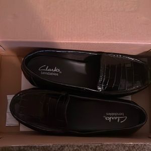 1️⃣1️⃣ black shiny square patterned low heels from Clark’s